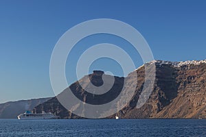 Panoramica of fira, santorini view of the sea with cruises. photo