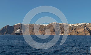 Panoramica of fira, santorini view of the sea with cruises. photo