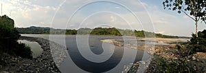 Panoramical view on the river, beach and tree and the forest in sunny tropical place.