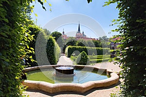 Panoranic view  to Old european castle park and fauntain, Prague, Czech republic. View through shrubbery.