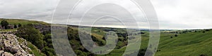 Panorma of Malham Cove landscape in Yorkshire Dales National Park in England on a cloudy day