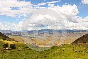 Panormaic view with white clouds and green countryside