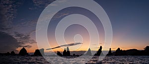 Silhouette of Hashigui-iwa Rocks at dawn photo