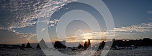 Silhouette of Hashigui-iwa Rocks at dawn photo