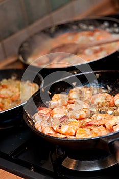 Pans of Cooking Shrimp photo