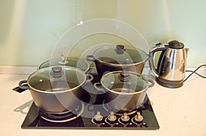 Pans on stove and kettle