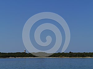 The Pantera bay with the lighthouse of Veli Rat