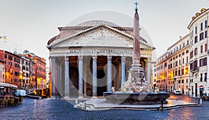 Pantheon, former Roman temple of all gods, now a church, and Fountain with obelisk at Piazza della Rotonda. Rome, Italy