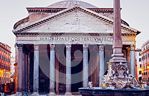 Pantheon, former Roman temple of all gods, now a church, and Fountain with obelisk at Piazza della Rotonda. Rome, Italy