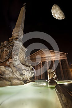 Pantheon, Fountain and Moon, historic building in Rome, Italy - Night