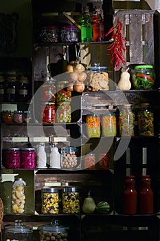 Pantry with Jars And Pickled Vegetables