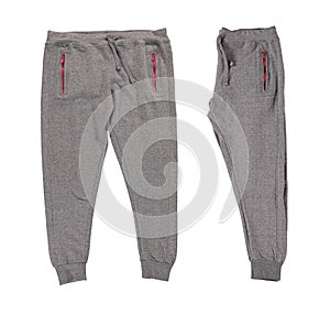 Pants folded in half. Warm gray pants with red zippers.