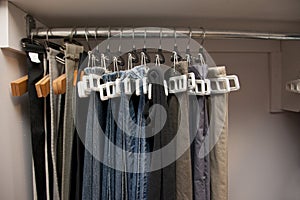 Pants hanging organized in closet