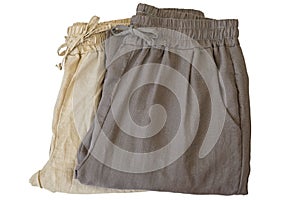 Pants made of cotton. Folded trousers in light dark brown, natural fabric cloths