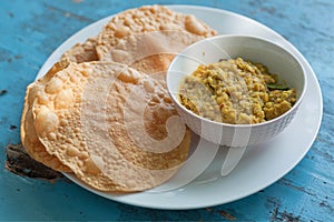 Papadum bread and vegetarian dal from lentils or beans. Food popular in Sri Lankan, Indian and Bangladeshi cuisines