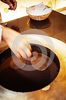 Papadum dough, Indian food appetizer in clay oven