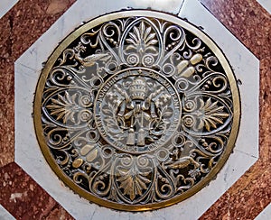 Papal seal on the floor of Saint Peter`s Basilica in Vatican