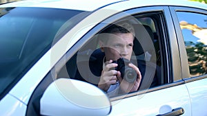 Paparazzi doing photo of celebrity from car, professional photojournalist