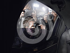 Paparazzi Shooting Through Car Window