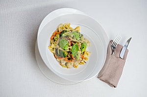 Papardelle pasta with cherry tomatos, broccoli, chive and fresh basil. Italian food. Italian cuisine. Symbolic image