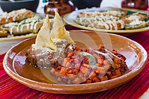 Papas with chorizo or potatoes with chorizo and refried beans, mexican food in Mexico City