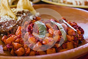 Papas with chorizo or potatoes with chorizo and refried beans, mexican food in Mexico City