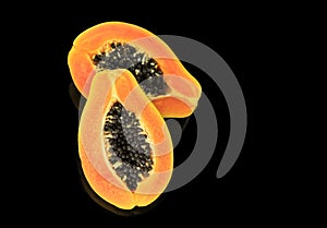 Papaya fruit isolated on black background. Half of fresh organic Papaya exotic fruit close up