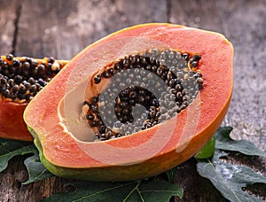 Papaya fruit on wooden background