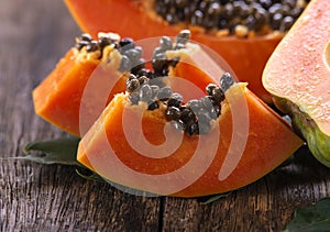 Papaya fruit on wooden background