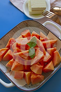 The papaya fruits salad on wooden bowl