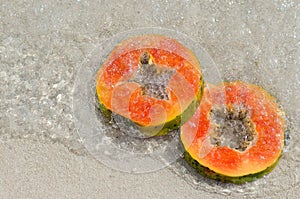 Papaya, hand, slice, tropical fruit, sea, sand
