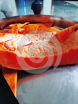 Papaya and knife in the plate