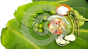 Papaya Salad display on banana leaf have free space isolate wite background