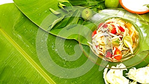 Papaya salad display on fresh banana leaf have free space