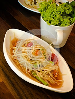 Papaya salad. Its name is `Somtum`.