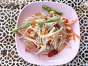 Papaya salad with young coconut shoots