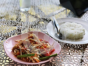 Papaya salad with young coconut shoots