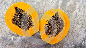 Papaya sliced into two halves photo