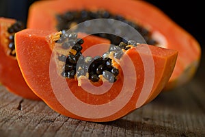 Papaya sliced on wood background