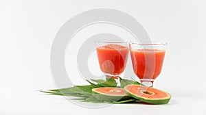 Papaya smoothie in glass jar and glasses on white background