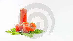 Papaya smoothie in glass jar and glasses on white background