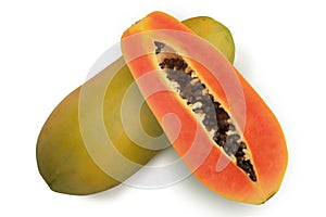 Papaya, whole and sliced. Delicious fresh exotic healthy fruits