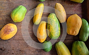 Papayas on wooden background