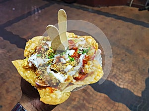 Papdi chaat indian spice hand held salty and sweet