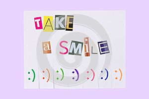 A paper ad with the phrase: Take a Smile and with smile signs ready to be tore off