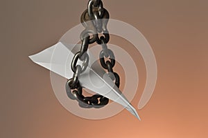 Paper airplane captured in a chain loop