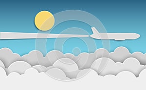 Paper airplane flying above clouds in blue sky