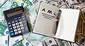 Paper with Anti-money laundering AML on a table