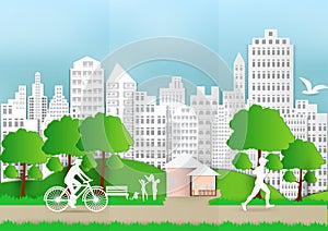 Paper art of people and pets with city and bicycle on green background, ecology idea