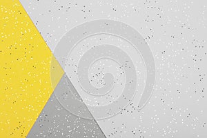 Paper background in two trendy colors of year 2021 - yellow and gray
